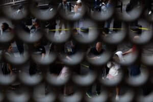 PHOTOS: Airline Travelers Encounter Armed ICE Agents at Airports Across the Country