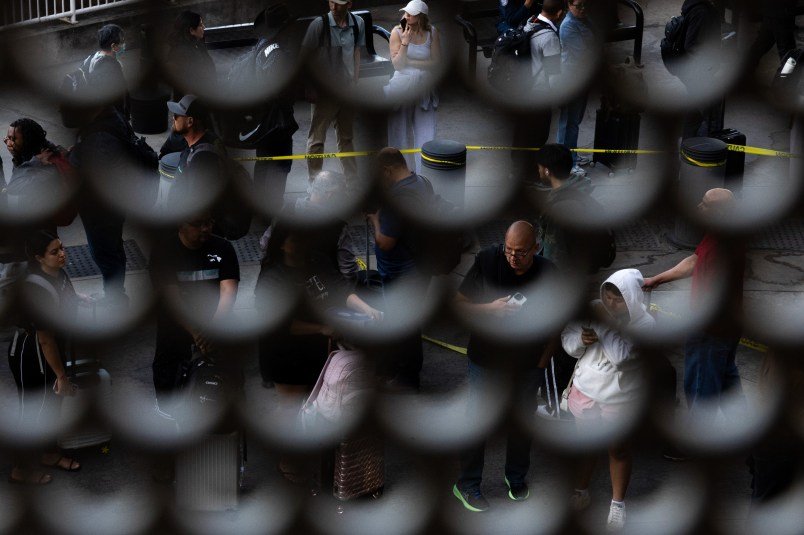 PHOTOS: Airline Travelers Encounter Armed ICE Agents at Airports Across the Country